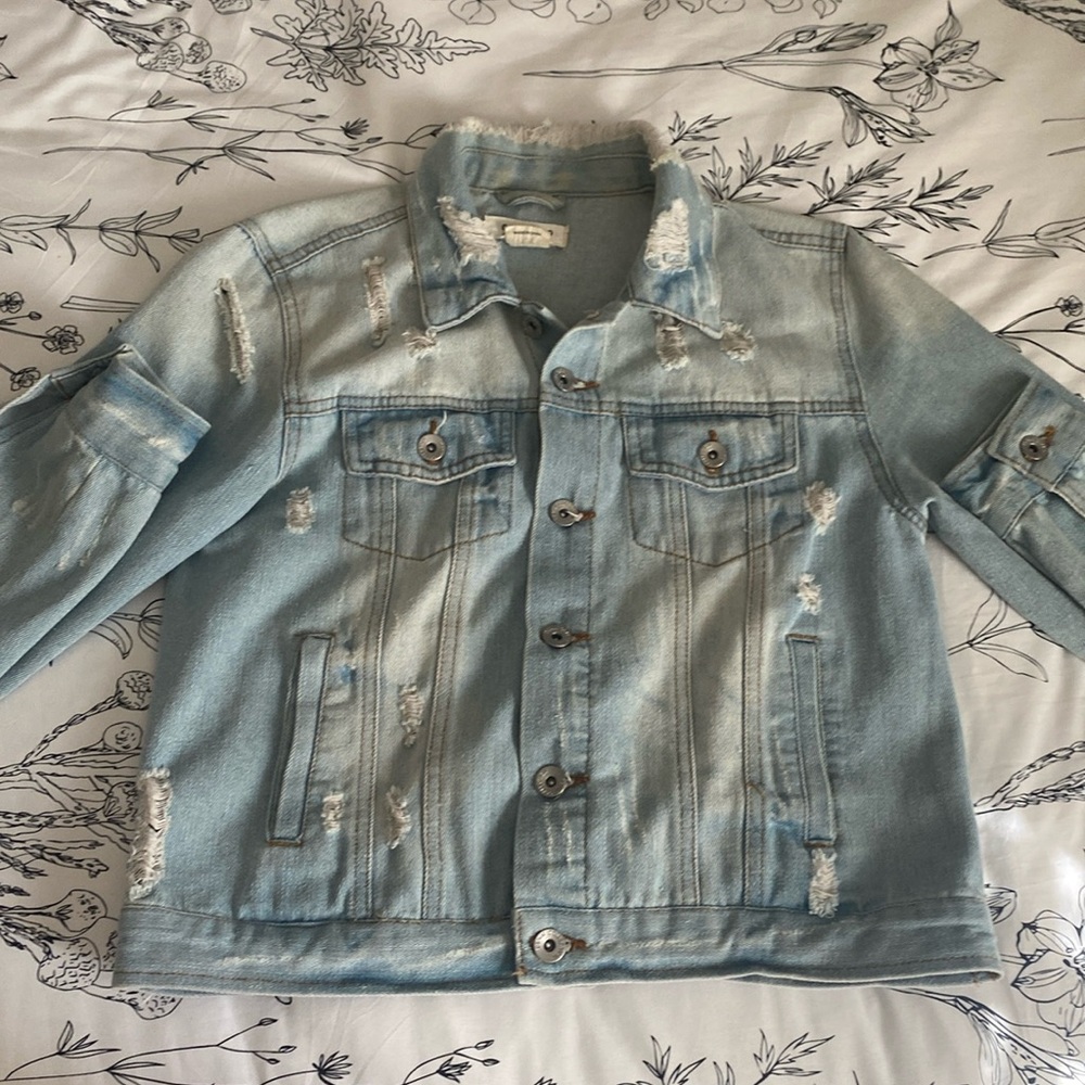distressed light wash ripped denim jacket